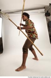 Man Adult Average Black Fighting with spear Standing poses Coat